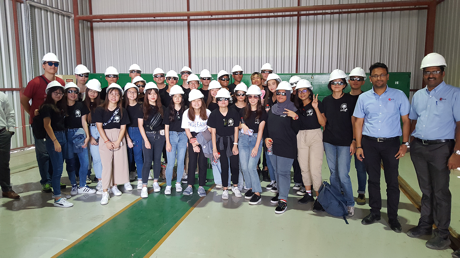 group of students in hard hats